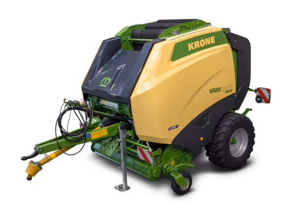 KRONE VariPack Pro rundballepress vist fra siden mot svart bakgrunn. Maskinen har gul og grønn fargekombinasjon med tydelig KRONE-merking.